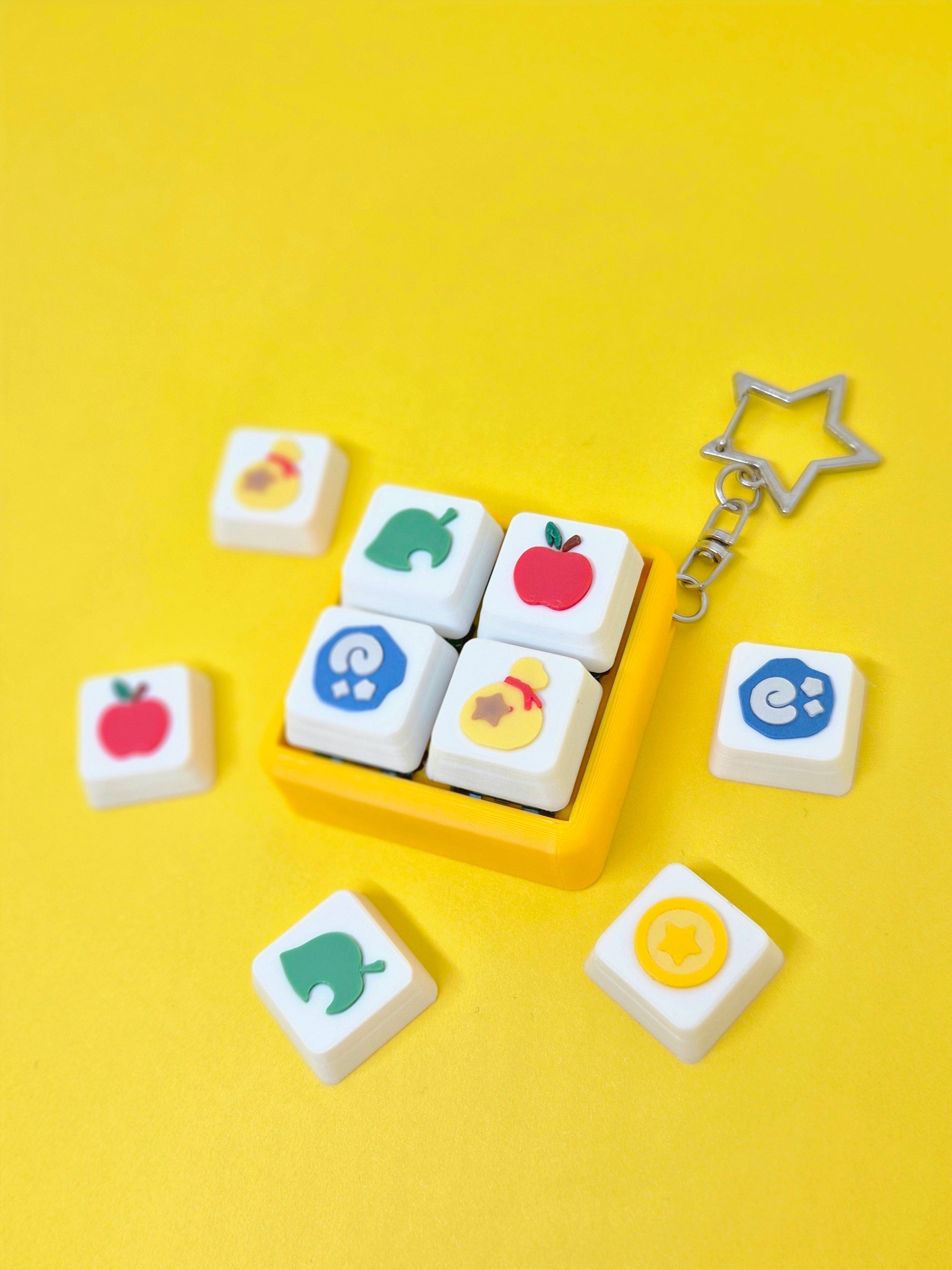 Animal Crossing-themed fidget clicker keychain by Masa Crafts Studio featuring a colorful animal crossing character design.
