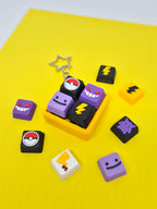 Pokemon-themed Masa Crafts Studio fidget clicker keychain with colorful keycap featuring a Pikachu design and metal keyring.
